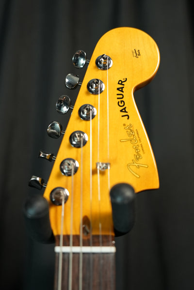 Close-up of headstock and maple neck on Fender American Professional Classic Jaguar 3-Color Sunburst electric guitar