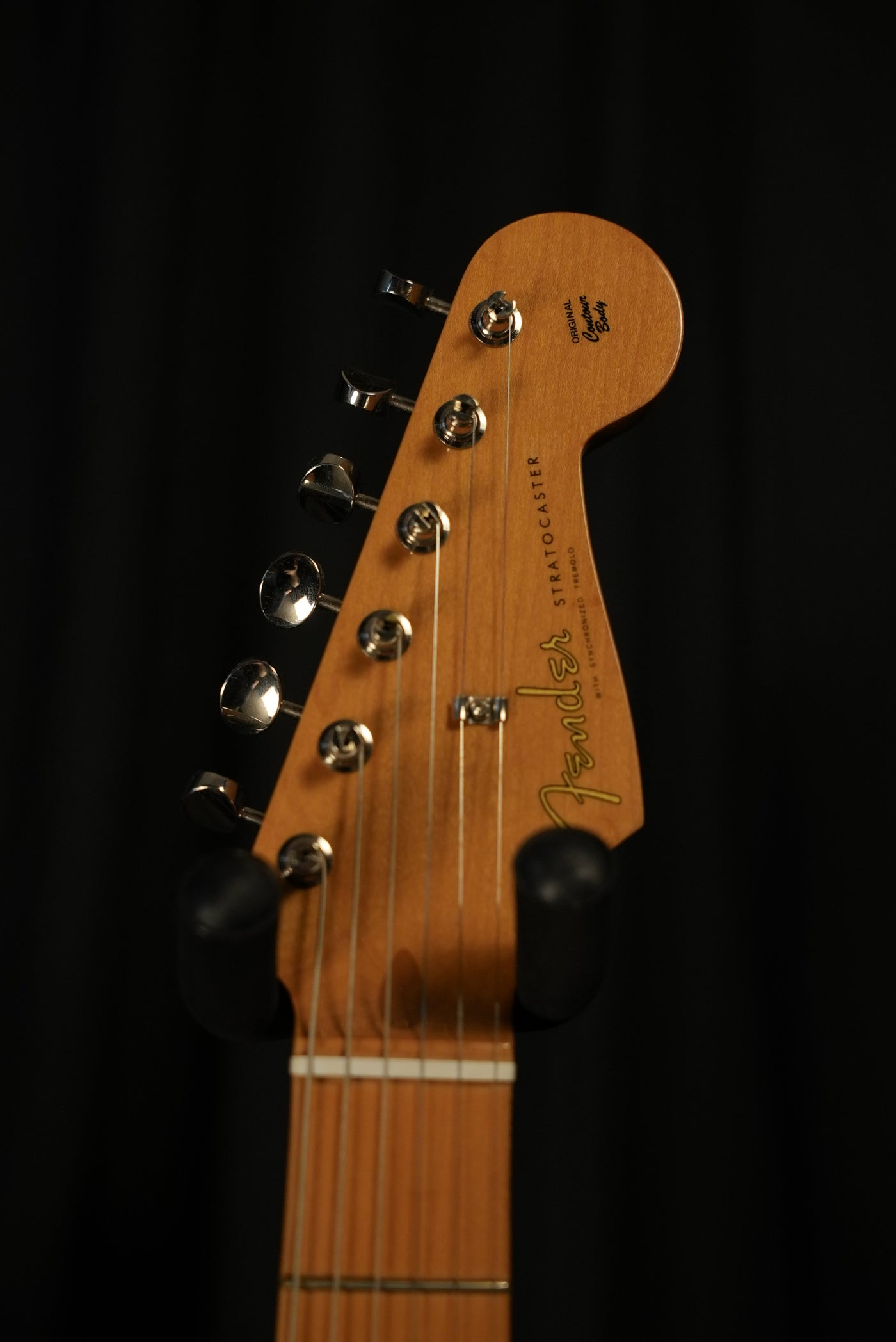 Close-up of headstock and mid-’50s Soft “V” maple neck on Fender Vintera II ’50s Stratocaster Black