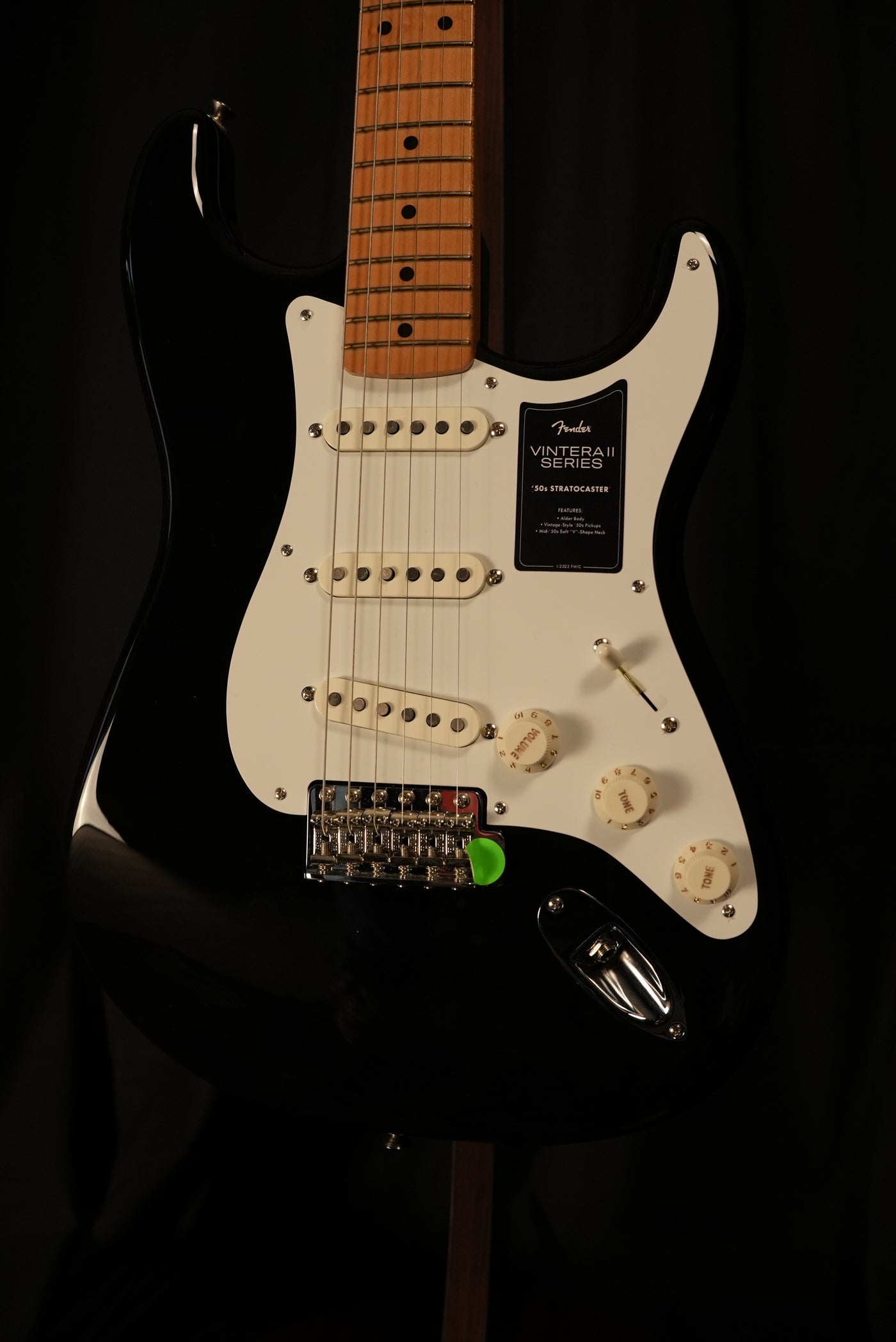 Detail of vintage-style ’50s single-coil Strat pickups and 6-saddle synchronized tremolo with bent steel saddles on Fender Vintera II ’50s Stratocaster Black