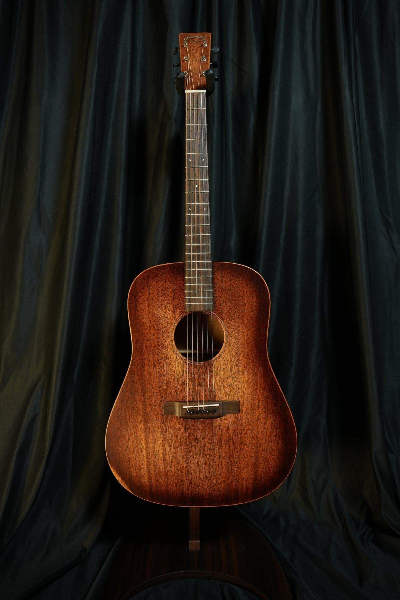 Angled full-body view of Martin D-15M StreetMaster showing the distressed satin finish and dreadnought silhouette