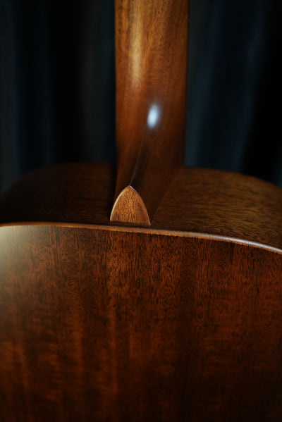 Neck joint of Martin D-15M StreetMaster showing solid mahogany back and sides with satin StreetMaster finish