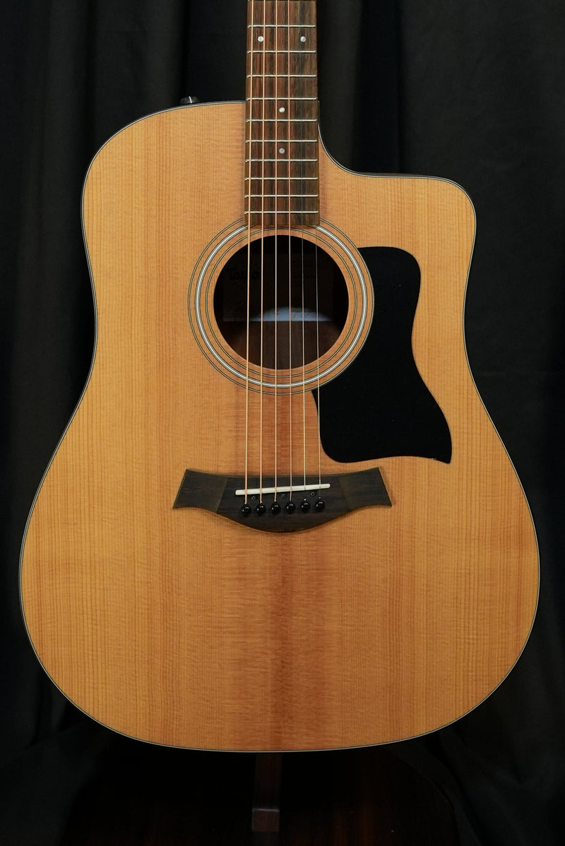 Front view of Taylor 110ce dreadnought acoustic electric guitar with solid Sitka spruce top