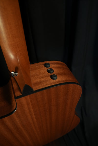 Top-bout view of the Taylor 150ce showing the Expression System® 2 preamp and control panel, delivering stage-ready amplification.