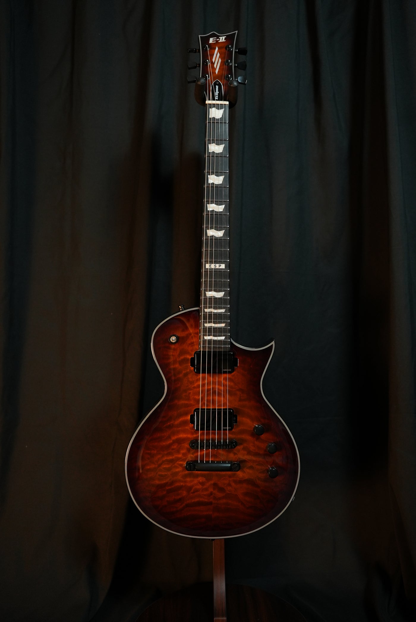 Headstock of ESP E-II Eclipse Tiger Eye Sunburst electric guitar with Gotoh locking tuners and ESP logo
