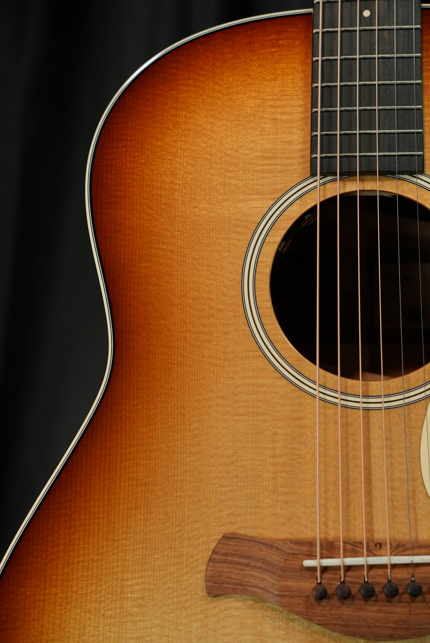 Taylor Gold Label 517e Sunburst torrefied Sitka spruce top Firestripe pickguard detail acoustic-electric