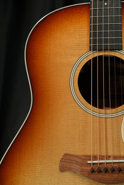 Taylor Gold Label 517e Sunburst torrefied Sitka spruce top Firestripe pickguard detail acoustic-electric