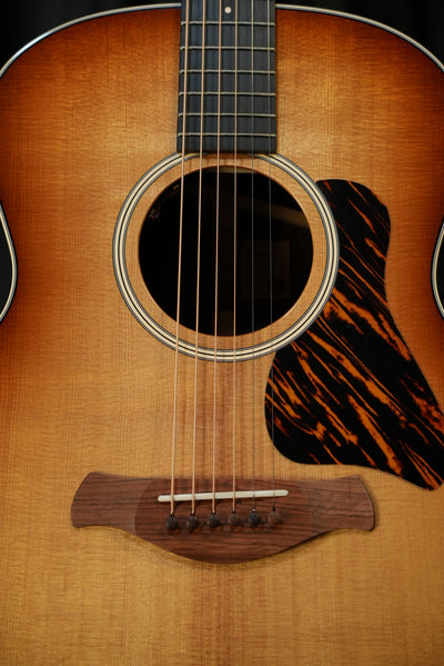 Taylor Gold Label 714e Sunburst torrefied Sitka spruce top Firestripe pickguard detail acoustic-electric guitar USA