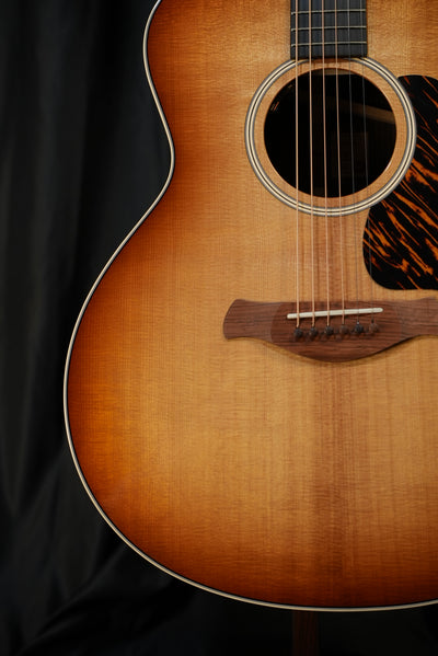 Taylor Gold Label 714e Sunburst torrefied Sitka spruce top Firestripe pickguard detail acoustic-electric guitar USA
